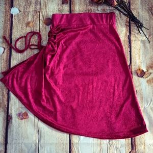 RED CRUSHED VELVET SKIRT WITH RUCHED SPLIT HEM